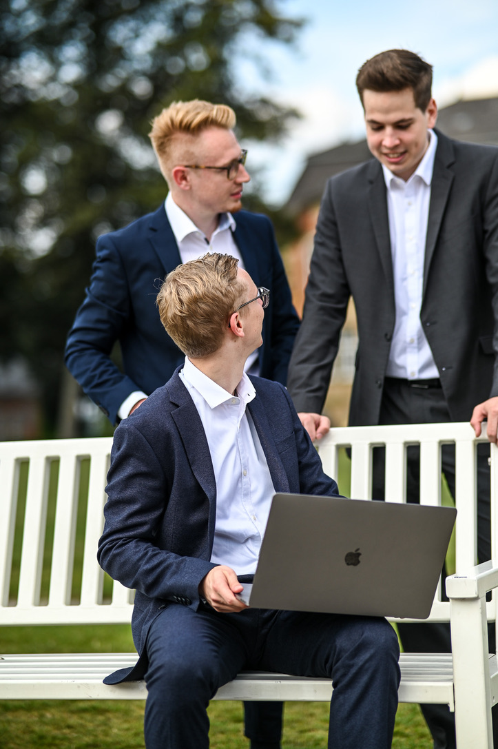 David Blomeyer working with colleagues outdoors